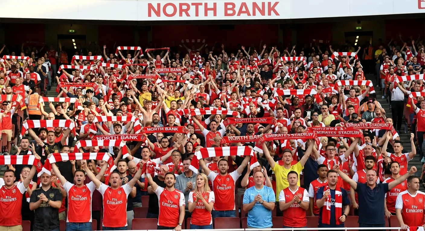 Arsenal fans celebrating in the Emirates Stadium stands