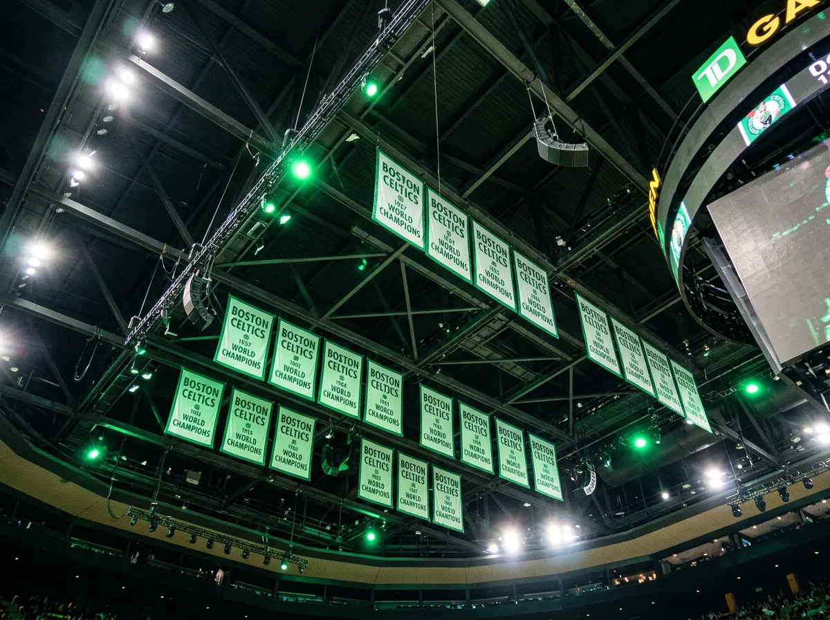 Boston Celtics championship banners hanging from arena rafters in green light