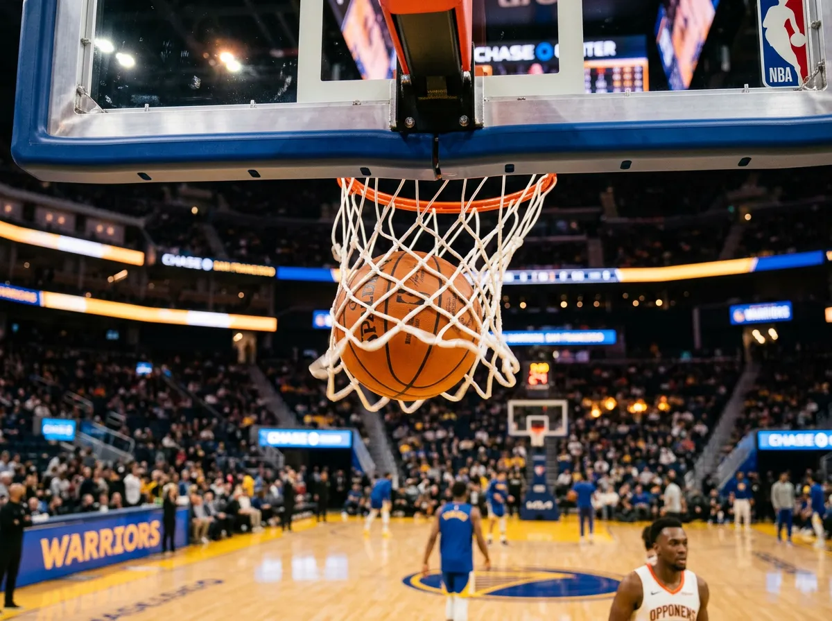 A basketball going through the net during warmups at an NBA arena
